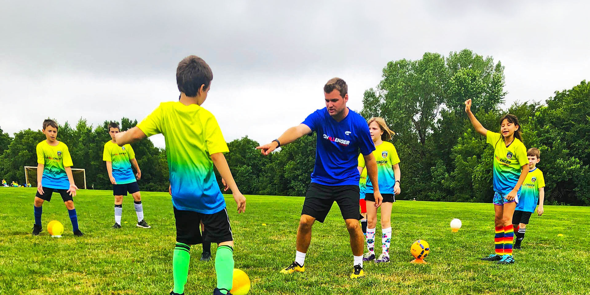 Challenger Sports Coach Instructing Young Soccer Campers