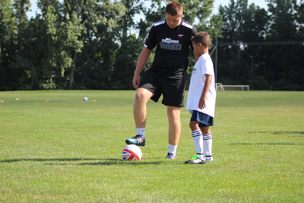 Coach one on one training with young player