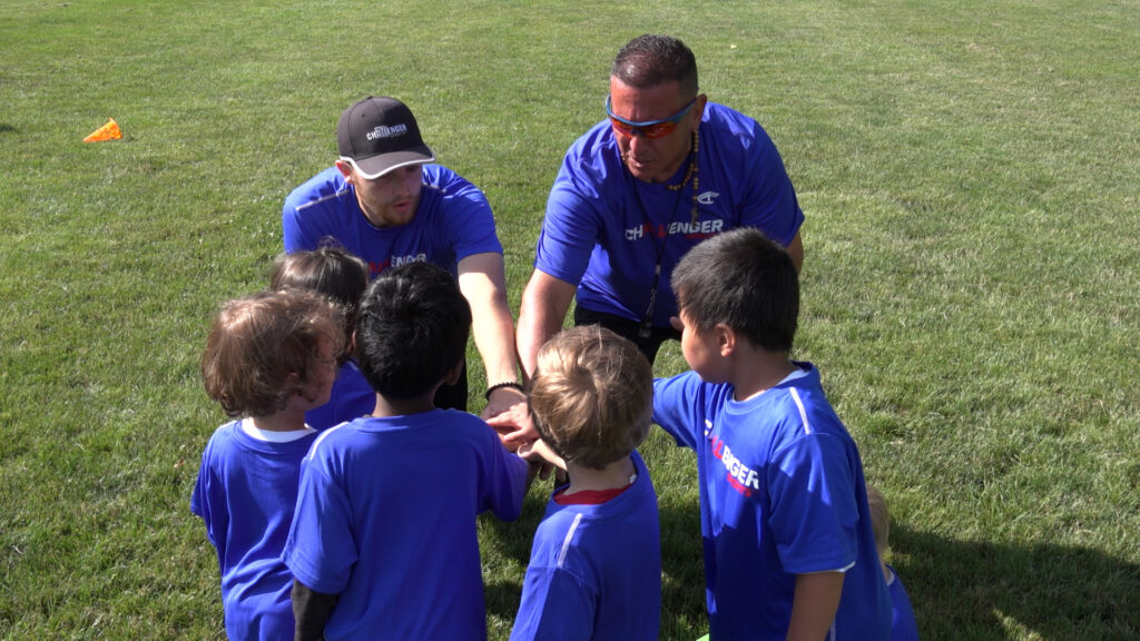 Coaches and players group scrum