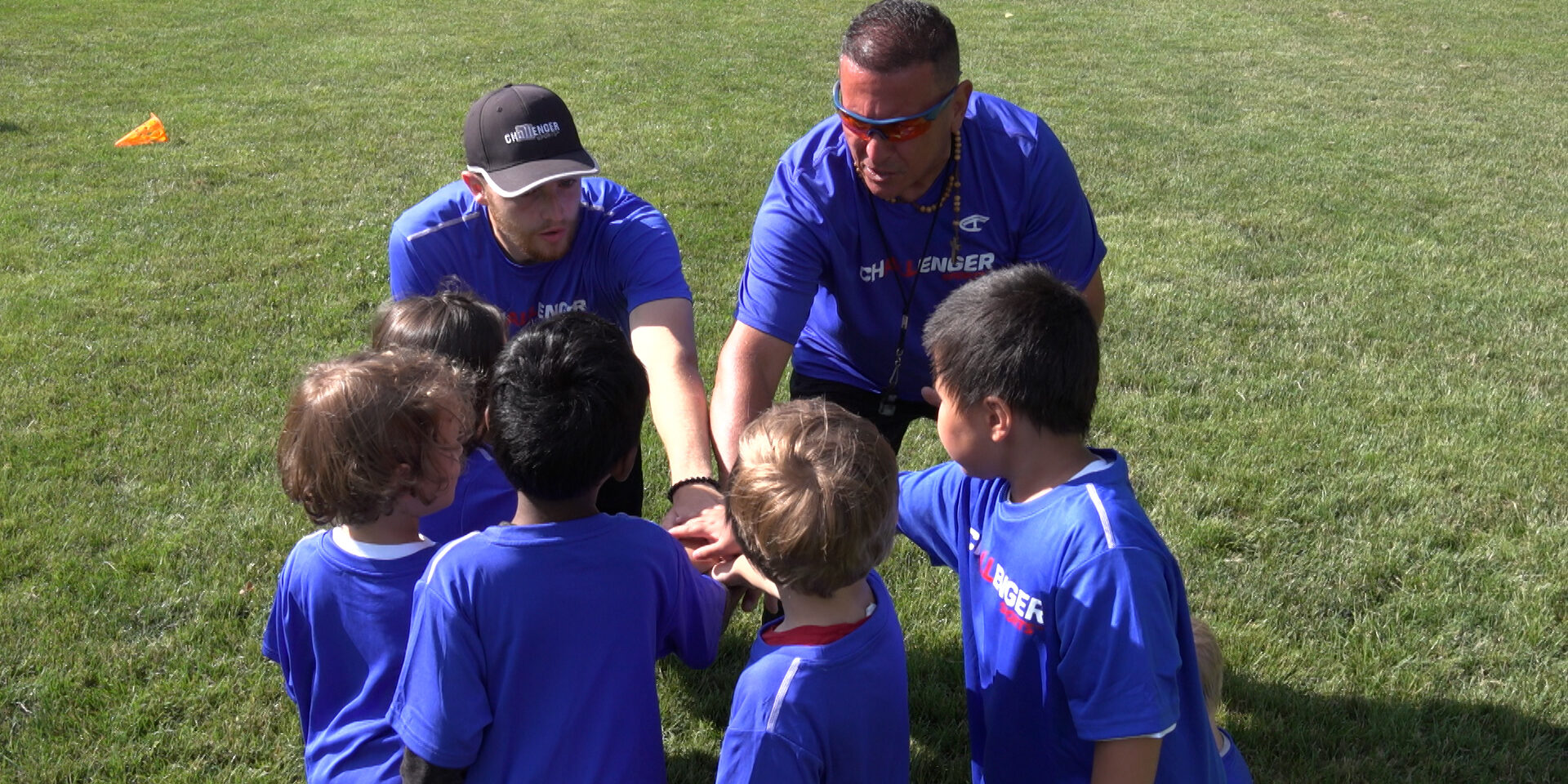 Coaches and players group scrum