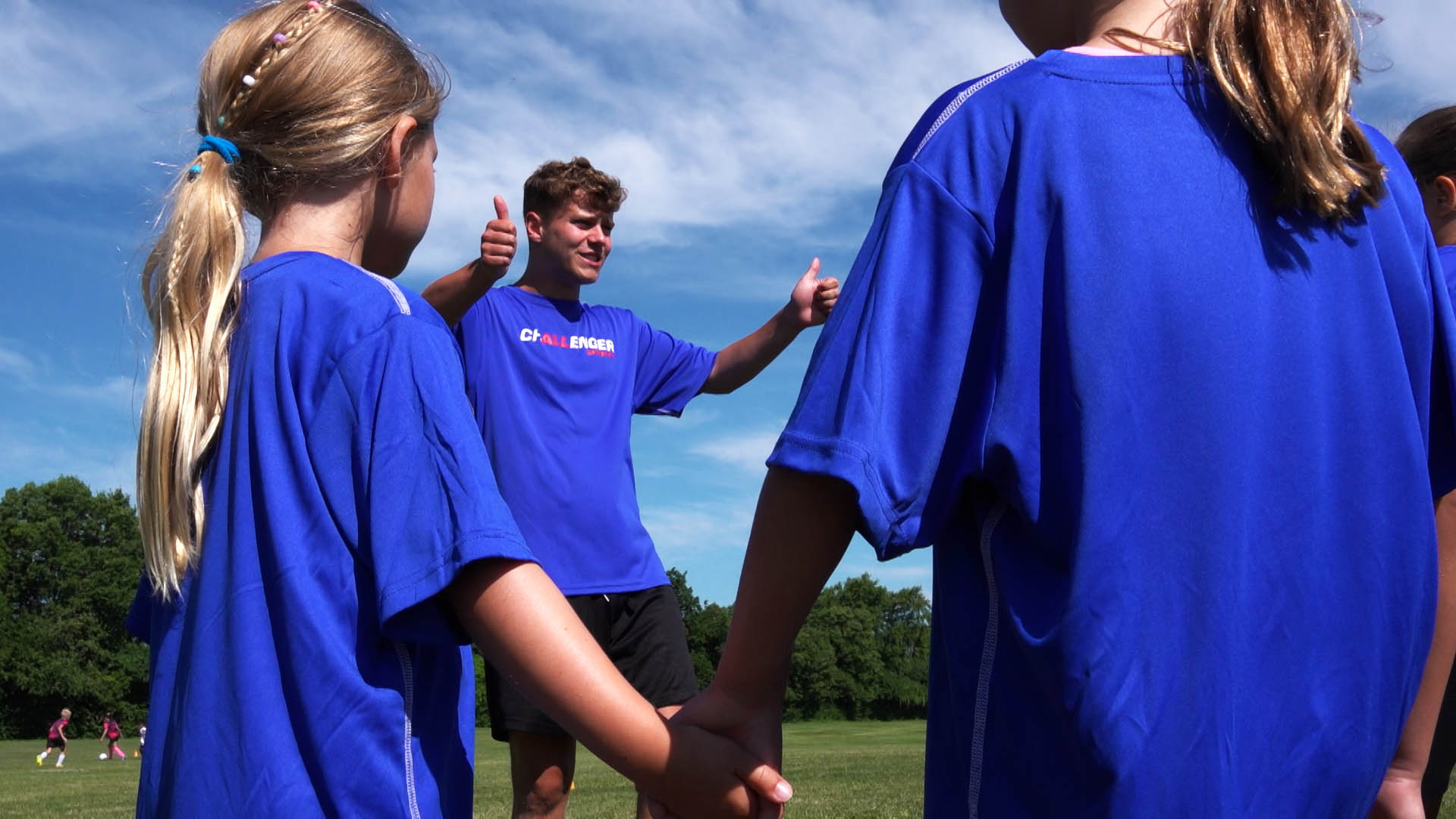 Coach giving players a thumbs up