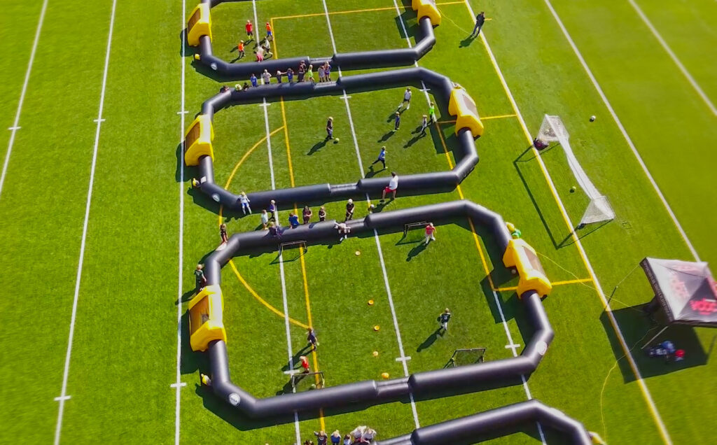 Aerial photo of soccer campers playing in 3v3 inflatable soccer fields