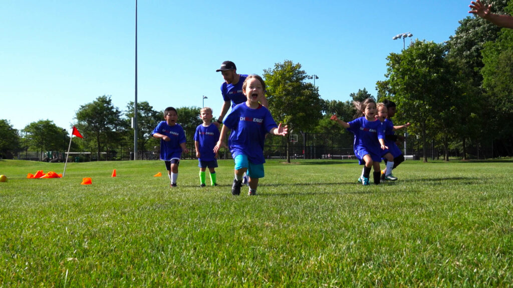 TinyTykes Soccer Camps Young Children Running On Camp and Having Fun